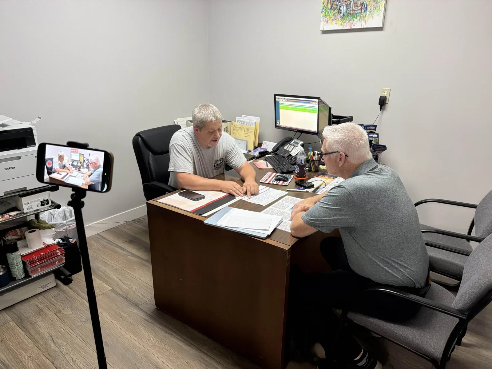 An Elite FI Partners agent recording a menu presentation with a finance manager